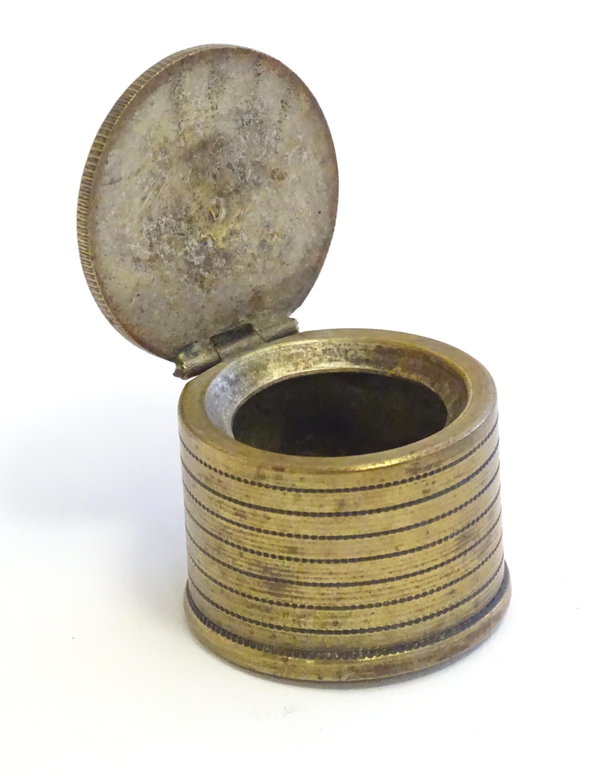 A 20thC Continental cast inkwell modelled as stacked coins, with applied French coins to top. - Image 6 of 9