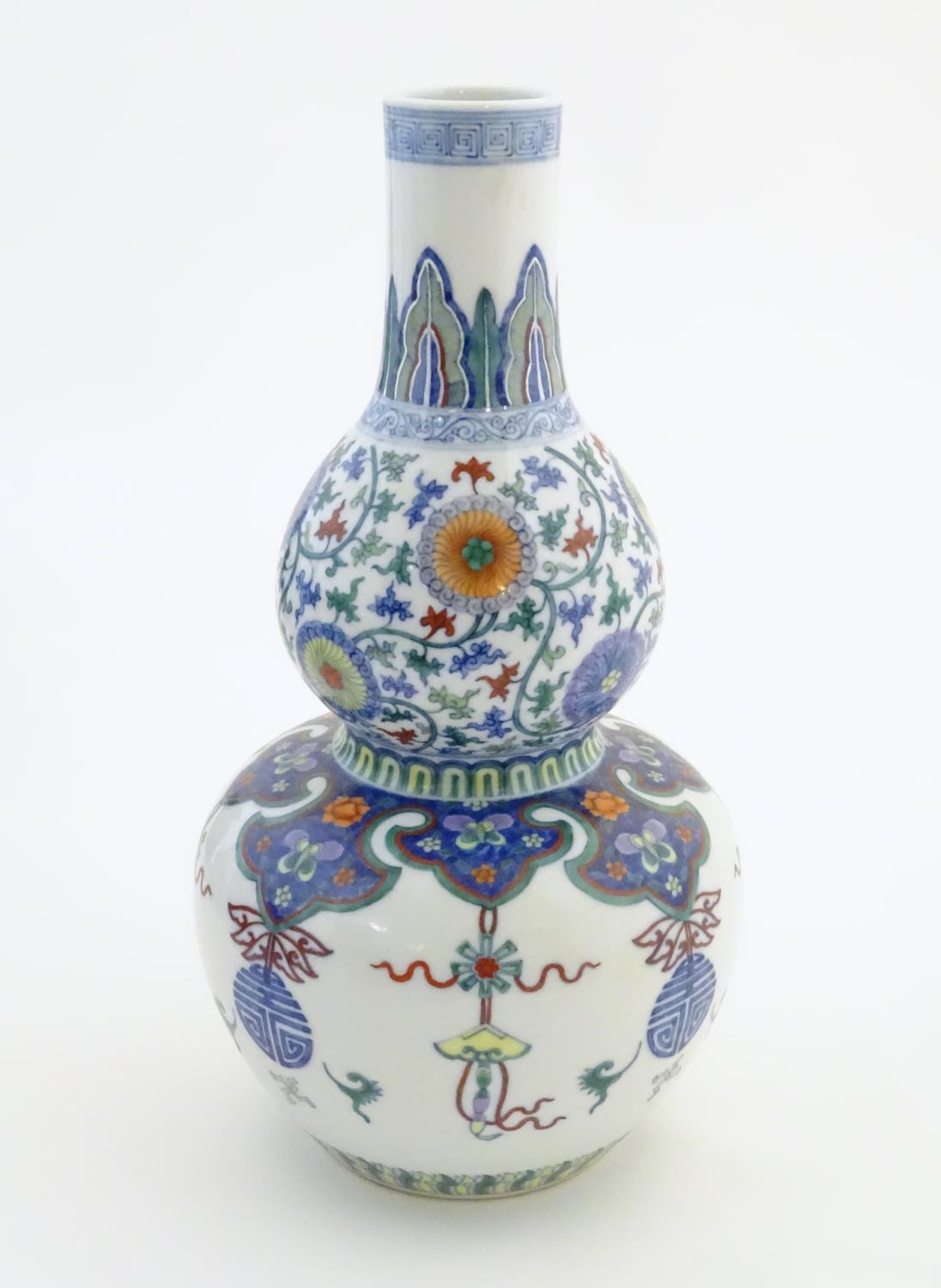 A Chinese double gourd vase with doucai style decoration with scrolling floral and foliate detail. - Image 8 of 16