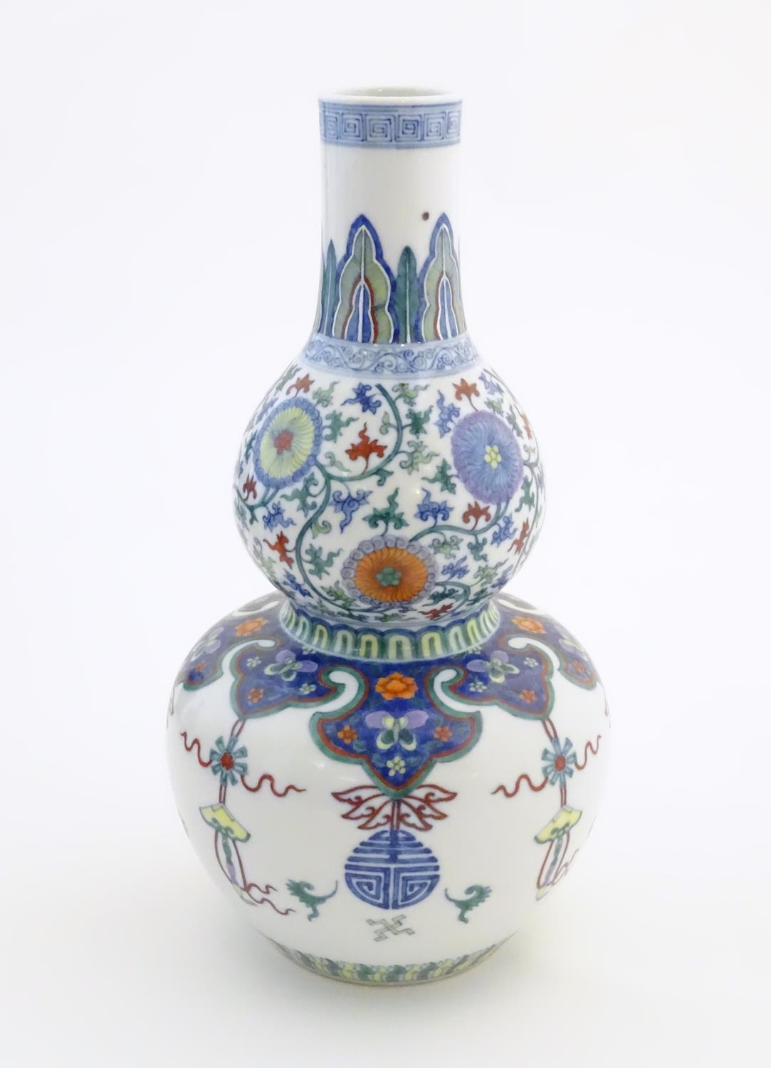 A Chinese double gourd vase with doucai style decoration with scrolling floral and foliate detail. - Image 2 of 16