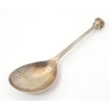 A silver spoon with seal top handle, hallmarked Sheffield 2000, maker C. J. Vander. Approx. 4 3/4"