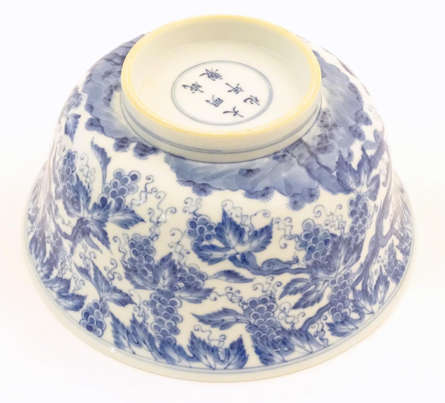 A Chinese blue and white bowl decorated with vine leaves and grapes. Character marks under. - Image 8 of 9