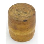 A 19thC boxwood treen container of barrel form with screw top and pokerwork decoration. Approx. 2