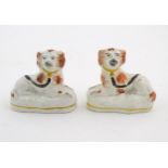 A pair of Victorian Staffordshire pottery seated spaniel dogs. Approx. 2 3/4" high (2) Please Note -
