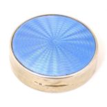 An Art Deco silver compact with blue guilloche enamel decoration to lid, hallmarked Birmingham 1929,