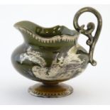 An Oriental pedestal cream jug with gilt dragon detail. Impressed marks under. Approx. 4" high