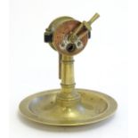 An early 20thC Continental novelty brass cigar / cheroot cutter and ashtray modelled as a nautical