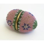 A Victorian etui / necessaire case of egg form with beadwork decoration. The interior with the