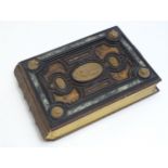 A late 19thC Austrian box formed as a book by Auguste Klein, the cover with inlaid carved panels