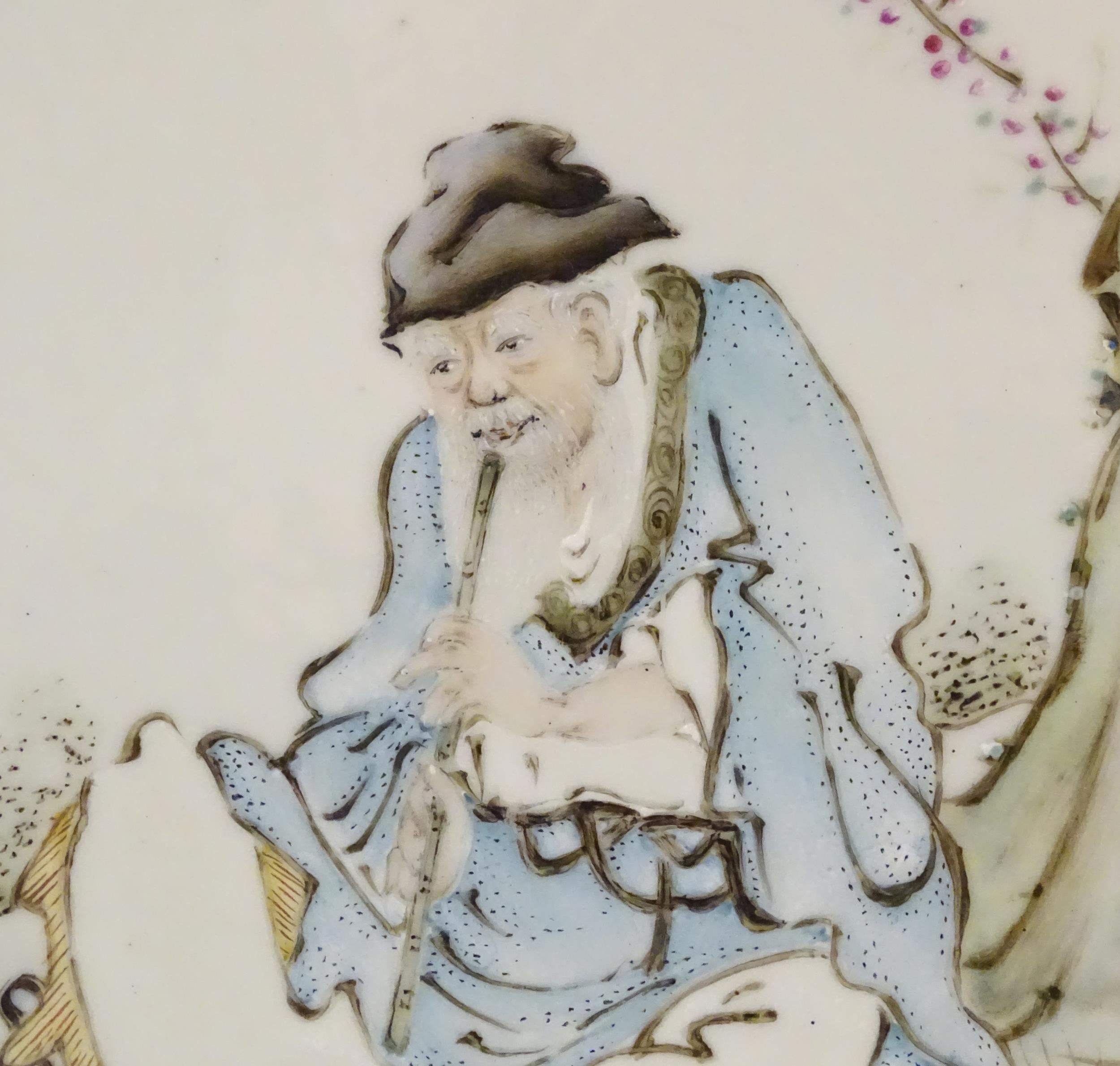A Chinese porcelain plaque decorated with a seated elder / scholar beneath a tree, with Oriental - Image 6 of 6