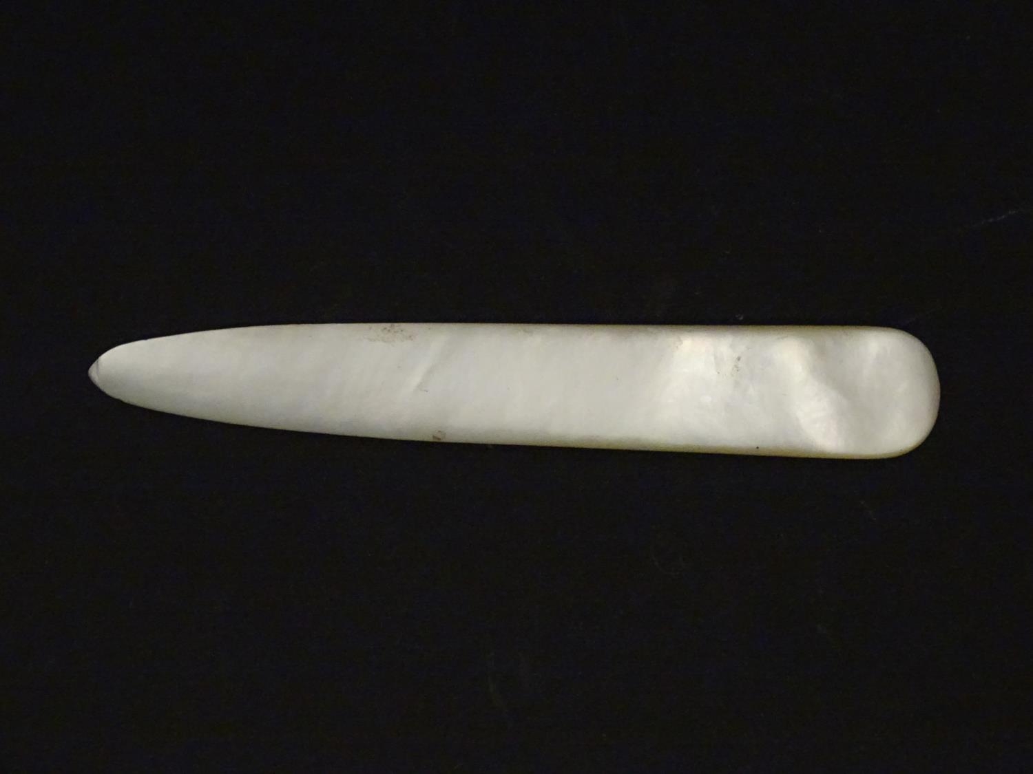 An early 20thC mother of pearl letter opener with shell detail. Approx. 4 1/4" Please Note - we do - Image 7 of 8