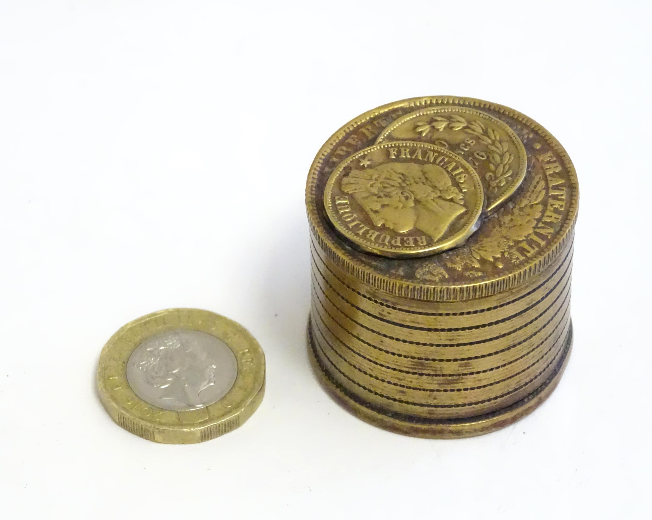 A 20thC Continental cast inkwell modelled as stacked coins, with applied French coins to top. - Image 2 of 9