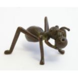 A 20thC cast model of an ant / insect with a berry. Approx. 2" wide Please Note - we do not make
