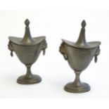 Two 19thC pewter salts modelled as lidded urns with twin lion mask ring handles. Approx. 5" high (2)