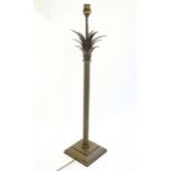 A Jim Lawrence table lamp, the reeded column surmounted by flared leaf detail. Approx 26" high