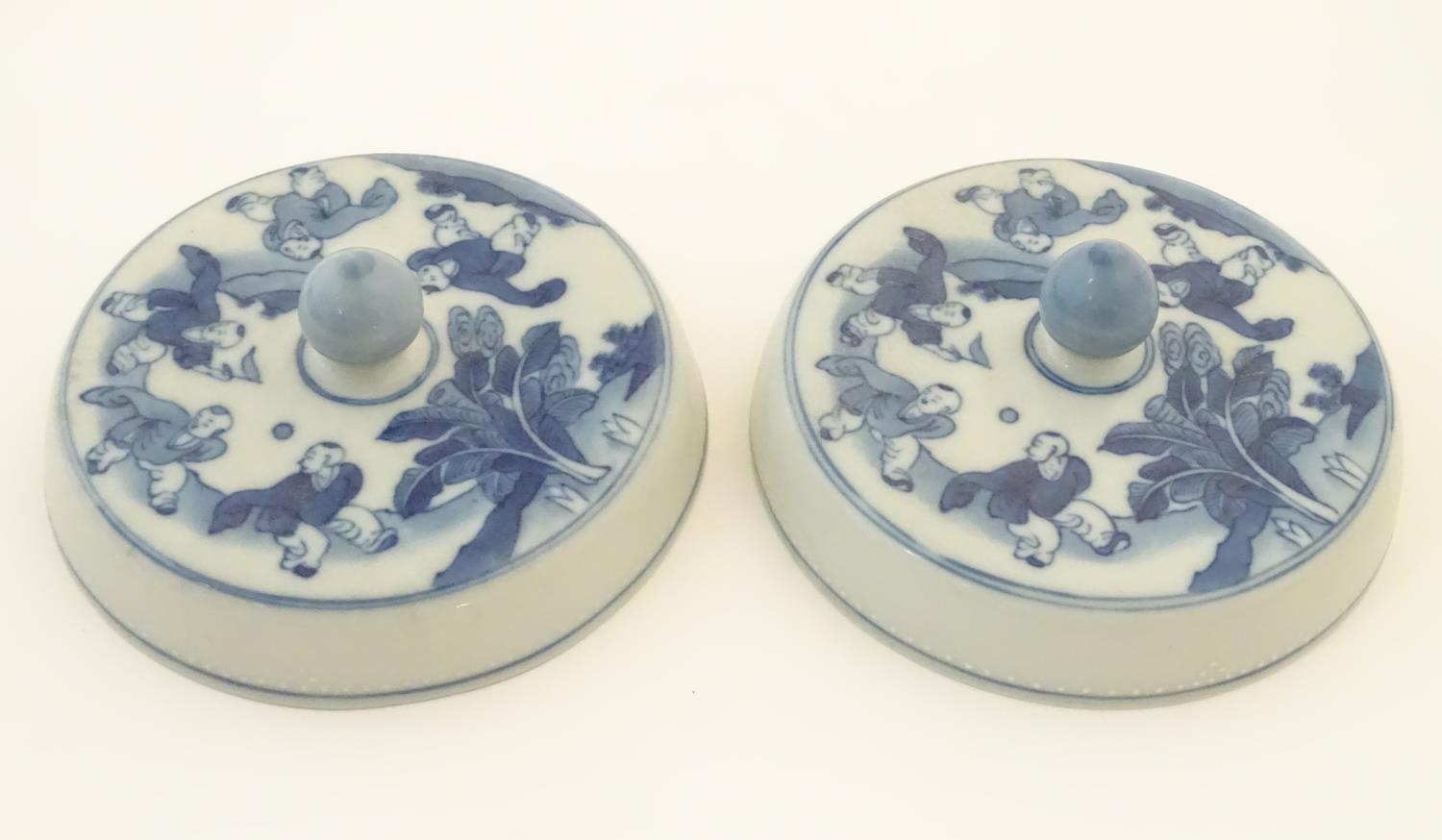 Two Chinese blue and white lids with figures in a landscape. Approx. 6 1/2" diameter (2) Please Note