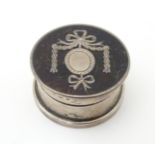 A silver pill box with pique work decoration to lid. Hallmarked London 1920. Approx 1 1/4"