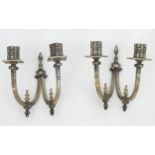 A pair of 20thC twin branch wall lights with Fleur de lys and stylised Georgian dolphin decoration