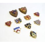 A collection of gilt metal enamelled collegiate insignia / badges, to include Keble College