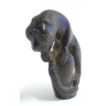 An Indian carved cane handle modelled as a stylised big cat and snake. Approx. 3" high Please Note -