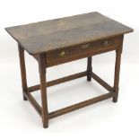 An 18thC oak side table with a rectangular planked top above a single long drawers with brass
