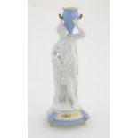 A Continental model of a classical / mythological figure with a star crown, holding a blue twin