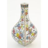 An Oriental vase of squared form decorated with flowers and birds. Possibly Japanese. Character