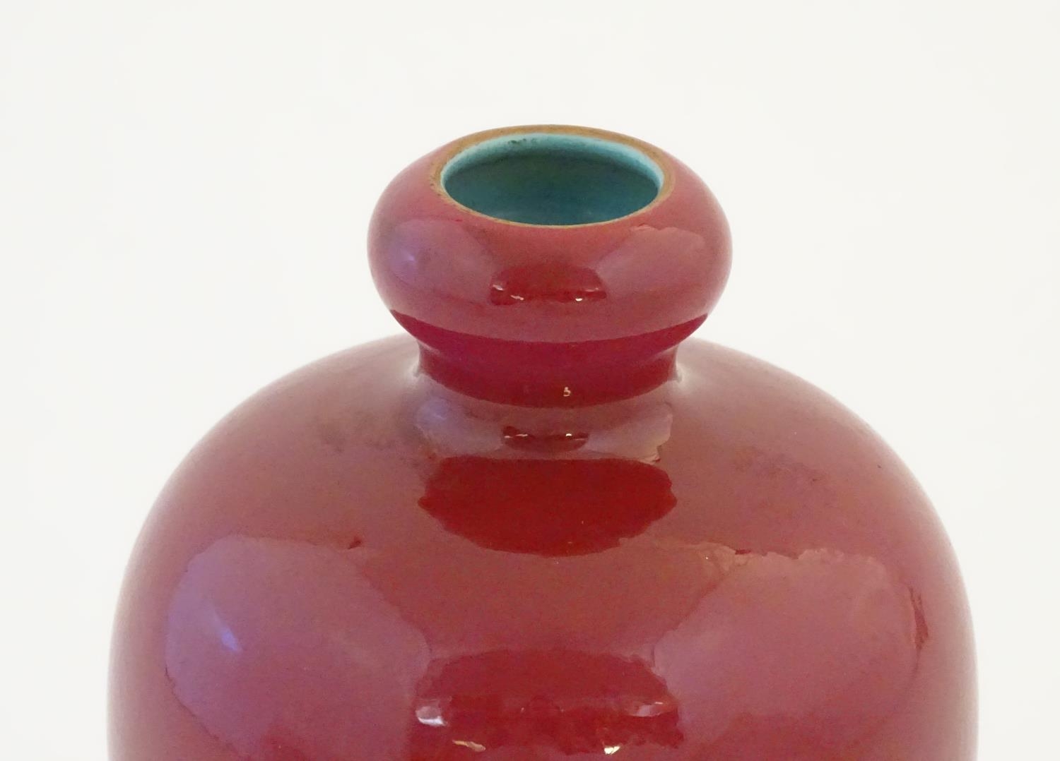 A Chinese baluster vase with a bulbous rim, with a ruby pink glaze and a turquoise interior. - Image 4 of 9