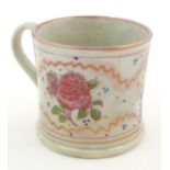 A Sunderland lustre mug with hand painted rose flower detail. Approx. 3" high Please Note - we do