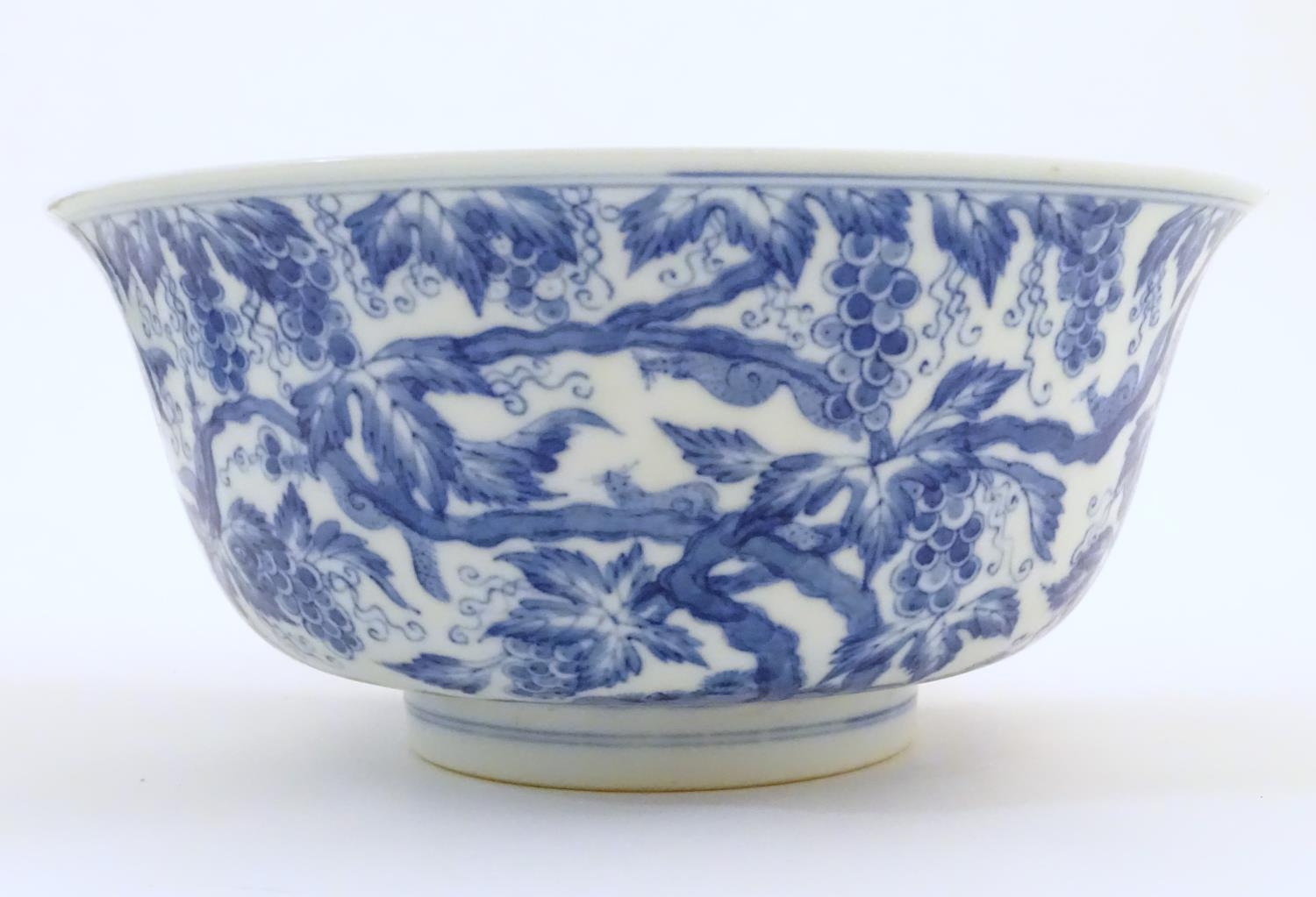 A Chinese blue and white bowl decorated with vine leaves and grapes. Character marks under. - Image 5 of 9