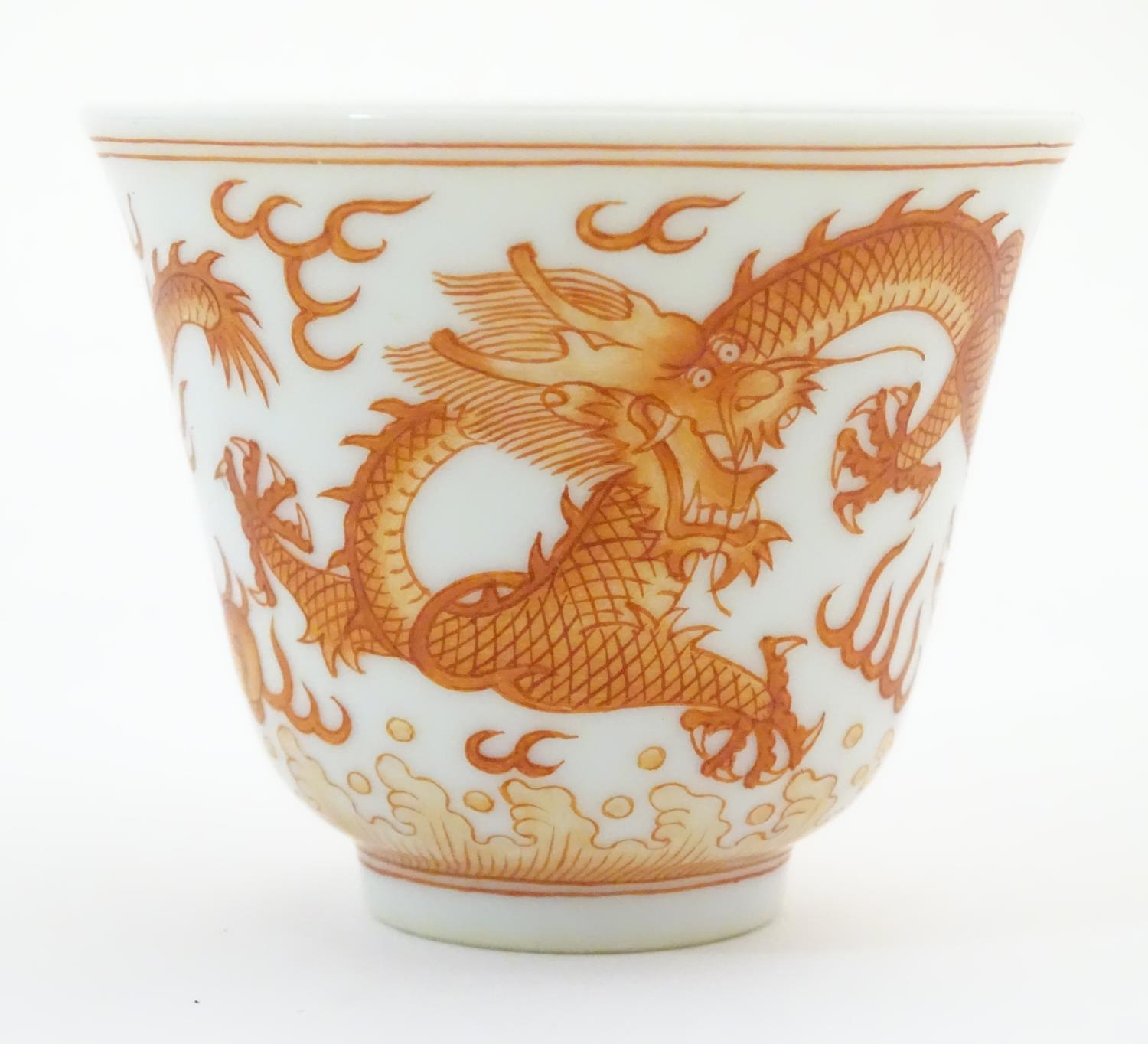 A Chinese wine cup with dragon detail and stylised flaming pearls and clouds. Character marks under. - Image 3 of 7