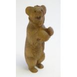 A Victorian black forest style carved wooden model of a bear standing. Approx. 7 1/2" high Please