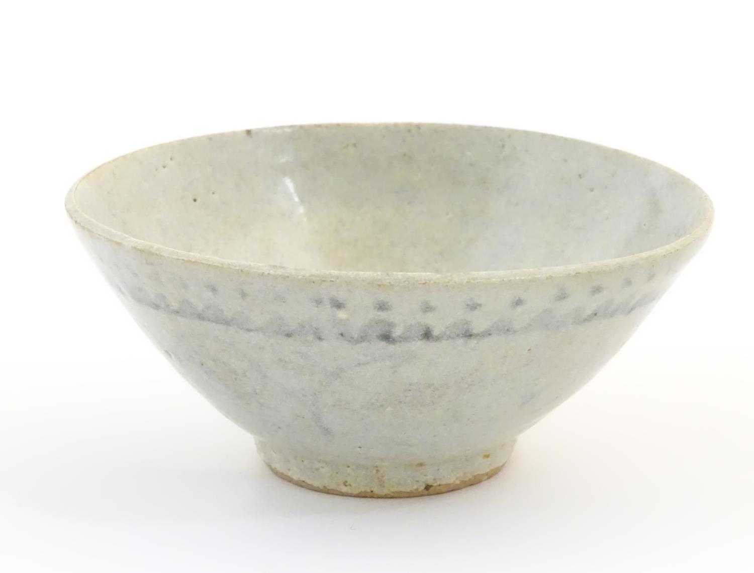 An Oriental earthenware bowl of tapering form with brushwork detail. Approx. 2 1/4" high x 5" - Image 3 of 7