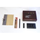 A late 20thC boxed Japanese calligraphy set, to include ink stone, brushes, brush rest etc. Box