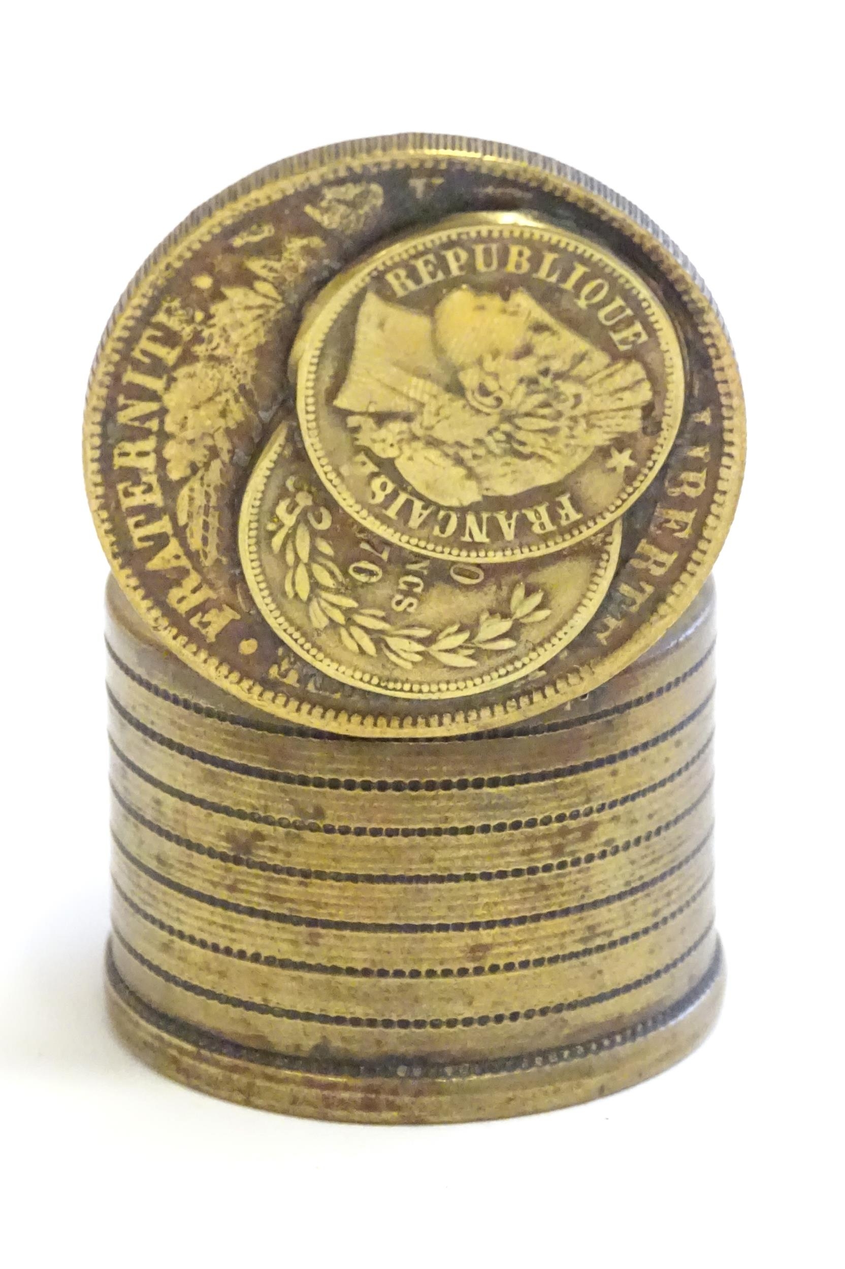 A 20thC Continental cast inkwell modelled as stacked coins, with applied French coins to top. - Image 8 of 9