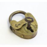 A 20thC cast padlock with anchor detail to keyhole cover. Together with key. Approx. 1 3/4" high