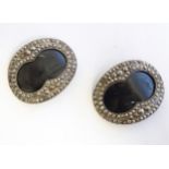 A pair of 19thC buckles of oval form with cut steel decoration. Approx. 2" wide (2) Please Note - we