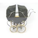 A mid 20thC coach built Royal twin doll's pram / perambulator, in grey painted finish with folding
