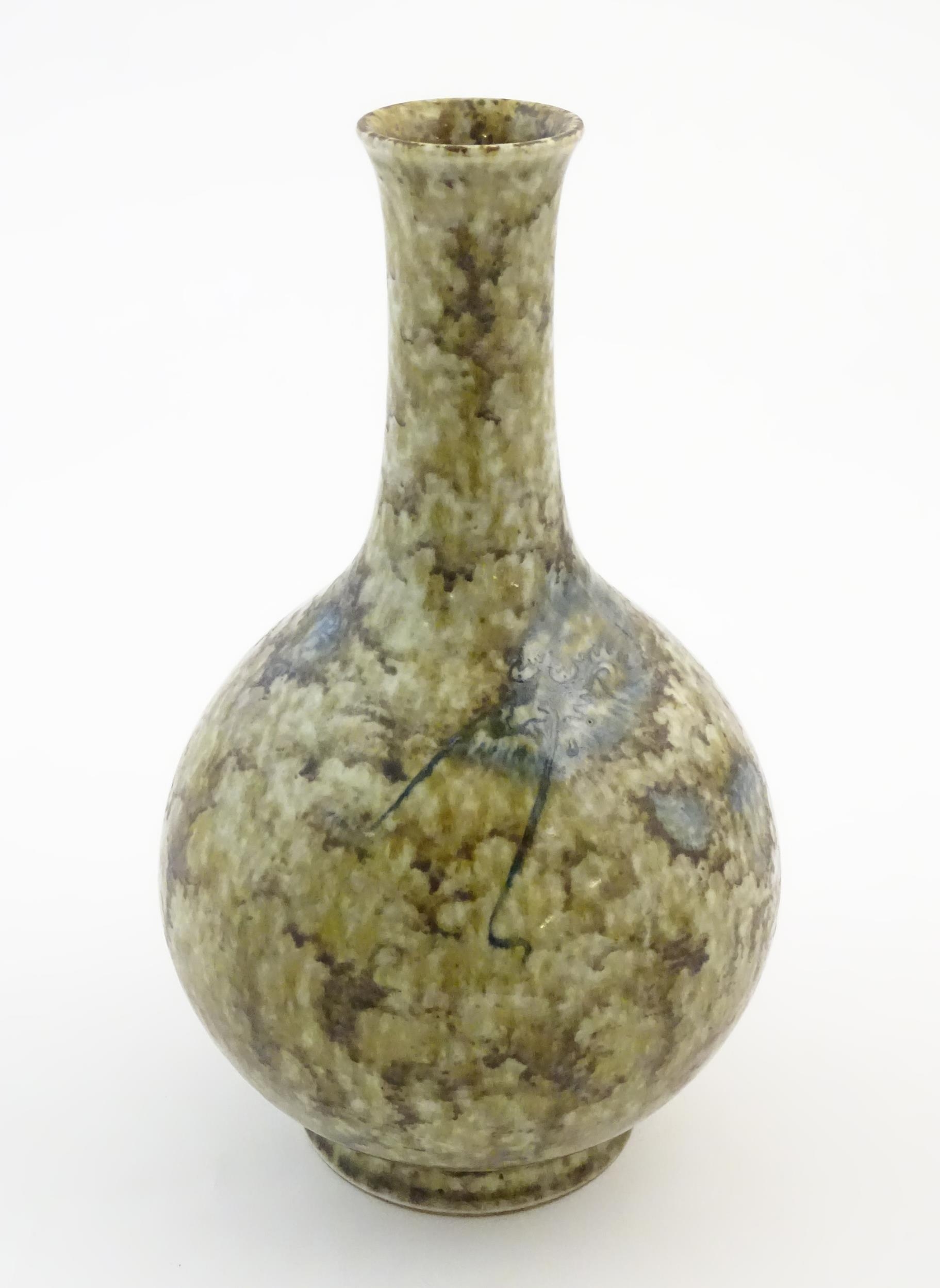 A Chinese bottle vase with a mottled glaze decorated with a stylised dragon face and claws, and - Image 6 of 9