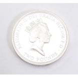 Coin: A 1989 silver £2 coin, depicting the Crown of Scotland and the inscription Tercentenary of the