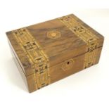 A Victorian walnut work box with geometric marquetry / parquetry decoration. Approx. 4 1/4" x 9 3/4"
