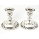 A pair of American sterling silver candlesticks by Gorham Manufacturing Co., marked under J. E.