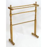 An early 20thC towel rail with turned supports. 25 1/2" long. Please Note - we do not make reference