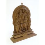 A 20thC Indian deity carving depicting two enthroned figures surrounded by attendants. Approx. 7"