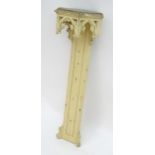 A 19thC painted Gothic pedestal wall shelf. 40" high. Please Note - we do not make reference to