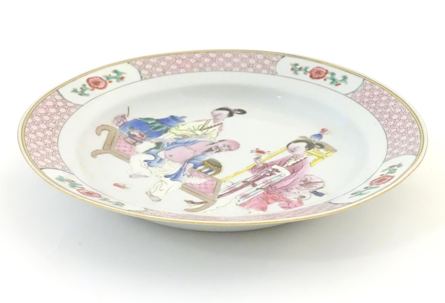 A Chinese famille rose plate decorated with an interior scene with an elderly scholar on a day bed - Image 4 of 5