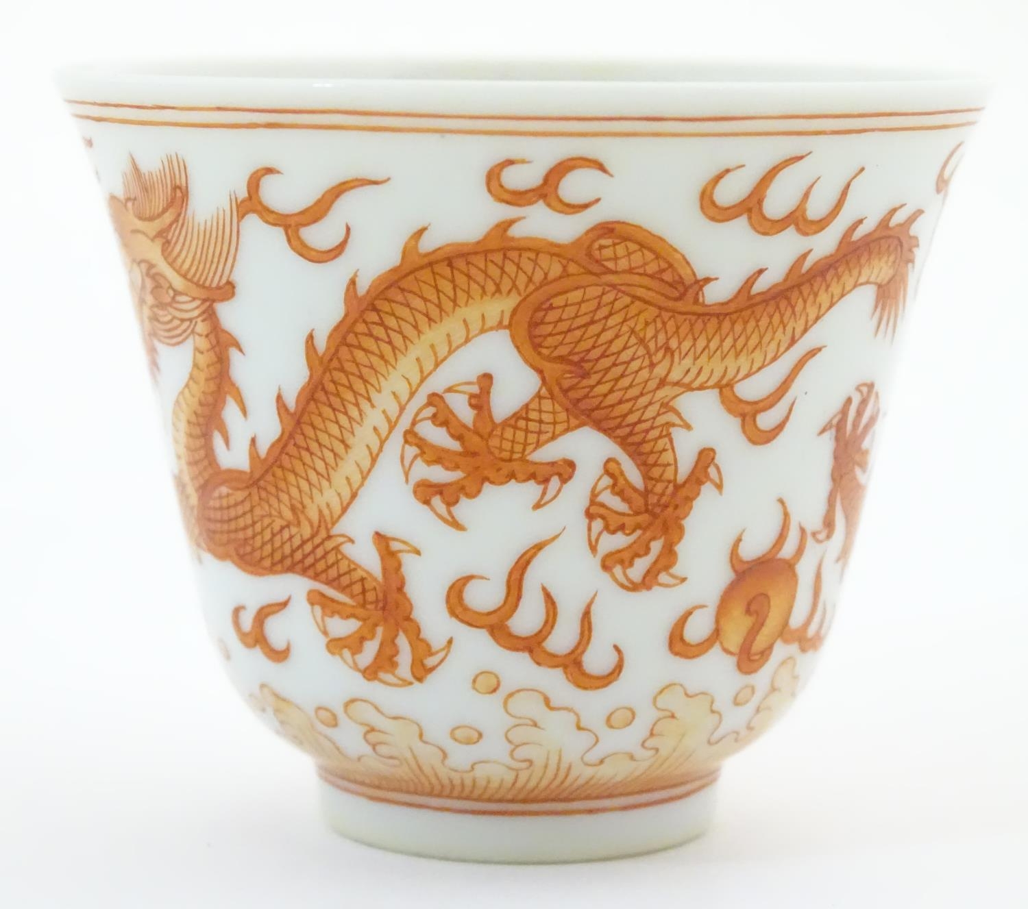A Chinese wine cup with dragon detail and stylised flaming pearls and clouds. Character marks under. - Image 4 of 7