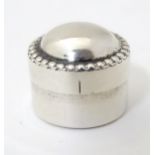 A white metal pill box approx 3/4" diameter Please Note - we do not make reference to the