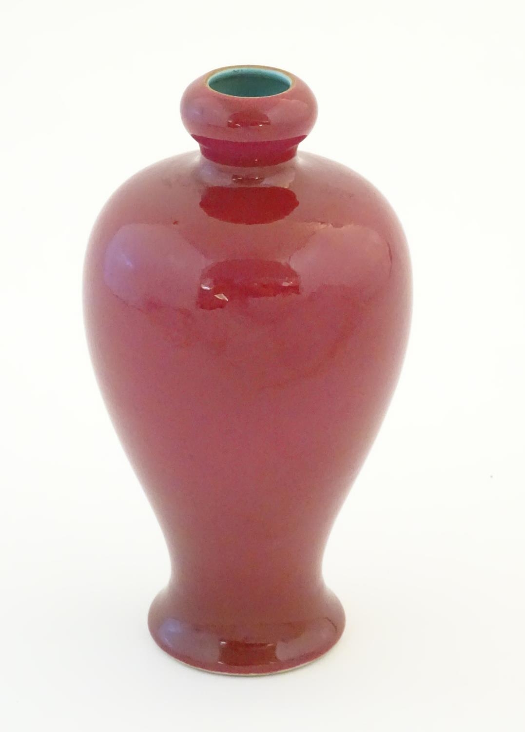 A Chinese baluster vase with a bulbous rim, with a ruby pink glaze and a turquoise interior. - Image 3 of 9