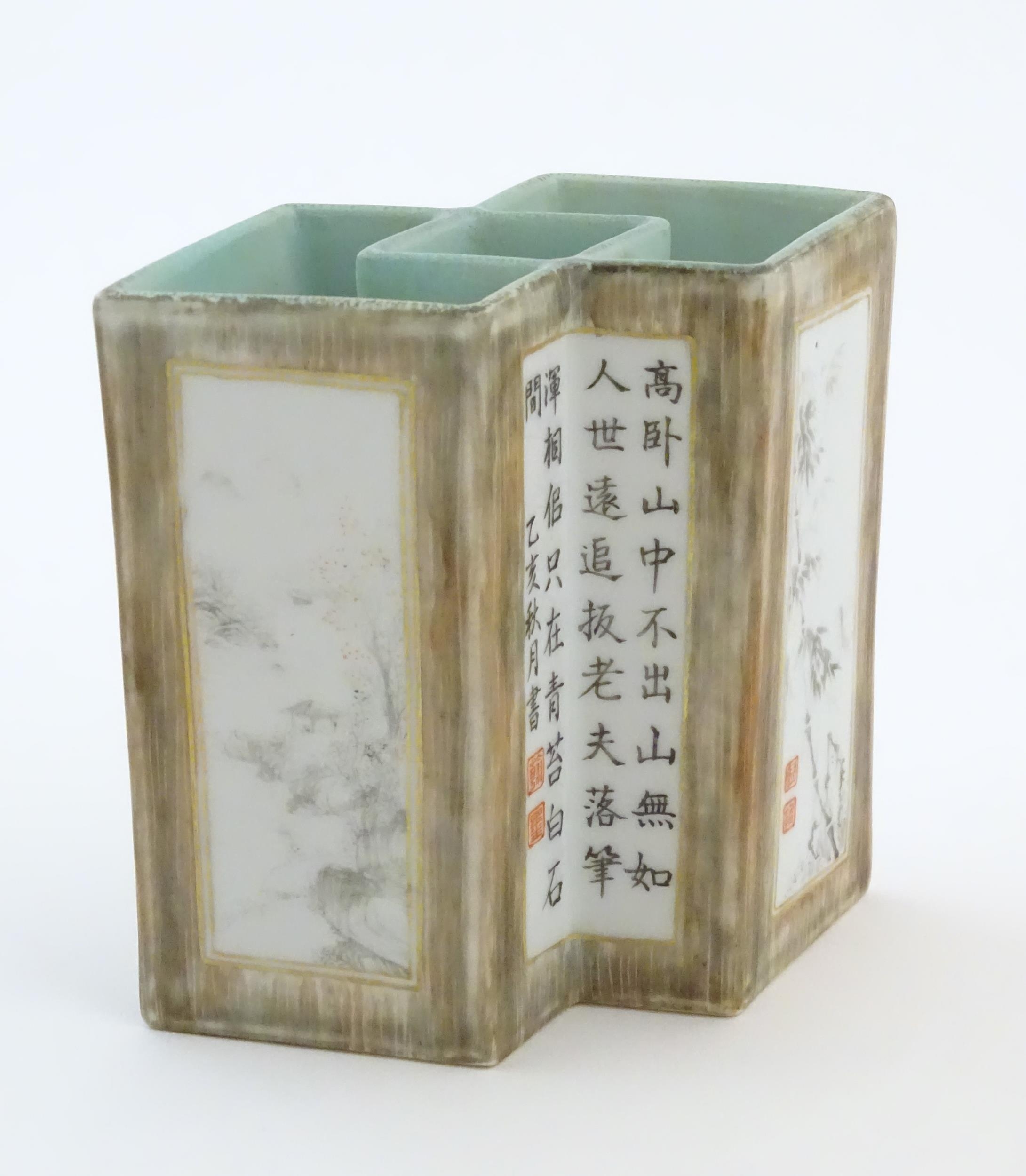 A Chinese brush pot of geometric form, decorated with grisaille landscape scenes, bamboo shoots