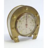A 20thC French thermometer mounted within a horseshoe frame. Approx. 3 1/4" high Please Note - we do
